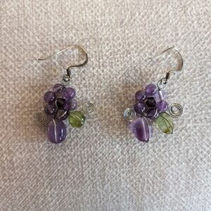 Silvery wire earrings with purple and green beads
